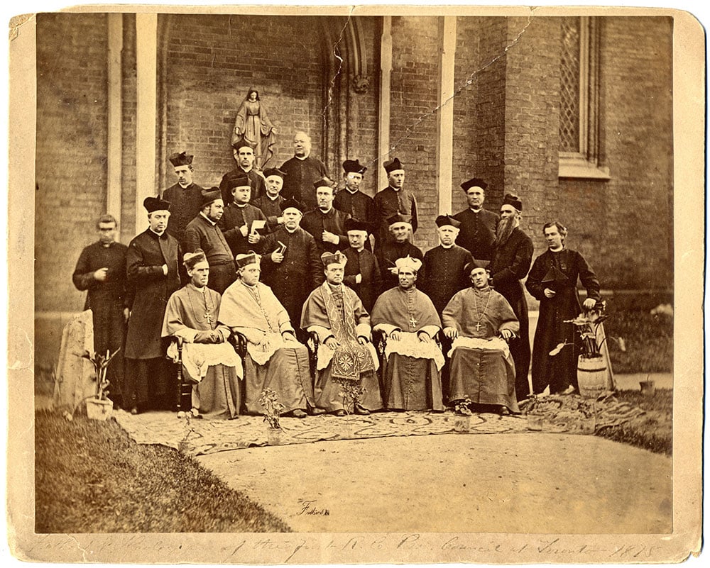 1875 Provincial Council Group Photo Black-and-white group of bishops and priests in episcopal dress in front of St. Michael's Cathedral.