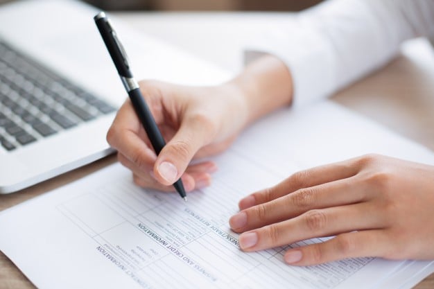closeup-of-business-person-completing-form_1262-2254 (FORMS 1).jpg