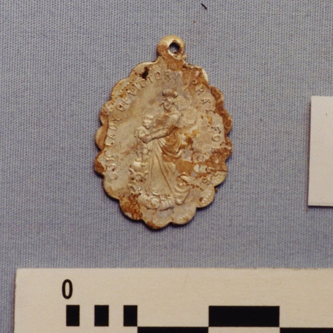 Gold coloured Our Lady of Victory medallion