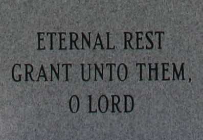 Memorial monument inscription reading "Eternal Rest Grant Unto Them, O Lord"