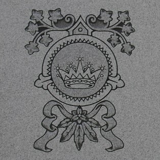 Memorial monument - Crown Memorial monument inscription of a circled crown with ivy leaves